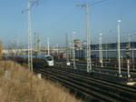 br-411-ice-t ICE1711 von Warnem�nde nach M�nchen Hbf.kurz nach der Ausfahrt im Rostocker Hbf.im Hintergrund zusehen die Rostocker Skyline,recht das BW Rostock dort zusehen ein 628er und ganz hinten steht ein 646er der Usedomer B�derbahn.(07.11.09)