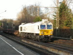 247 007 mit Brammen und leeren Waggons fr Blechrollen am 10. Januar 2011 bei der Fahrt durch Bochum-Hamme.