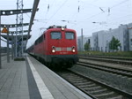110 284-7 mit DZ 2790 von Warnemnde Richtung Berlin-Lichtenberg bei der Ausfahrt im Rostocker Hbf.(11.09.10)