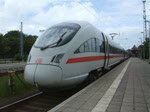 411 028-4 als ICE 1615 von Warnemnde nach Mnchen Hbf kurz vor der Abfahrt um 13.02 Uhr im Bahnhof Warnemnde.(12.06.10)