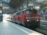 218 104-8 mit RE21607 von Kiel Hbf.nach Bad Kleinen bei der Ausfahrt um 07.04 Uhr im Lbecker Hauptbahnhof.(02.05.09)