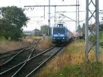 145 023-6 der Firma Eisenbahn-Bau- und Betriebsgesellschaft Pressnitztalbahn GmbH(PRESS)mit Holzzug von Stendal-Niedergrne nach Rostock-Bramow bei der Einfahrt um 06.08 Uhr im Bahnhof