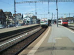 Voralpenexpress nach Luzern verlsst gerade den Bahnhof Romanshorn.