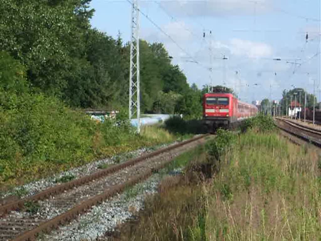 112 114-4 mit Sonderzug von Warnemnde nach Berlin-Ostbahnhof bei der Durchfahrt im Bahnhof Rostock-Bramow.Gefilmt am 12.07.09 