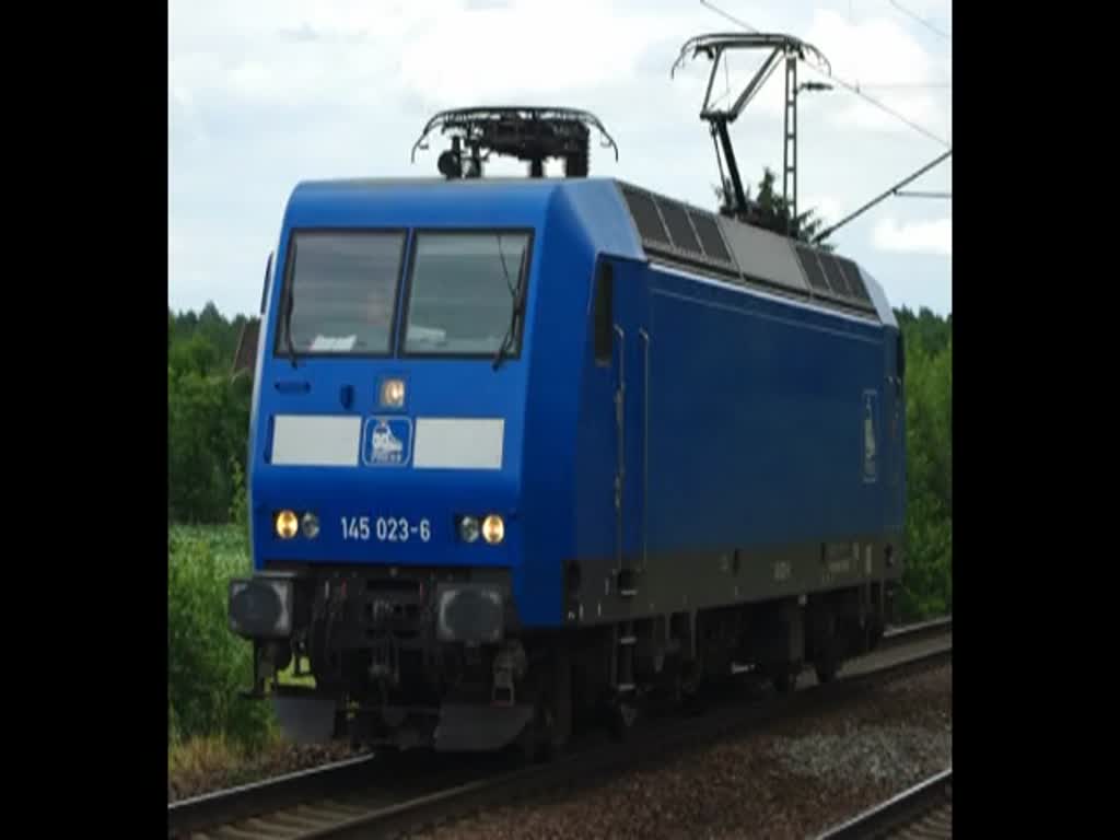 145 023-6 Lz in Richtung Norden durch Radbruch. Aufgenommen am 06.07.2010.