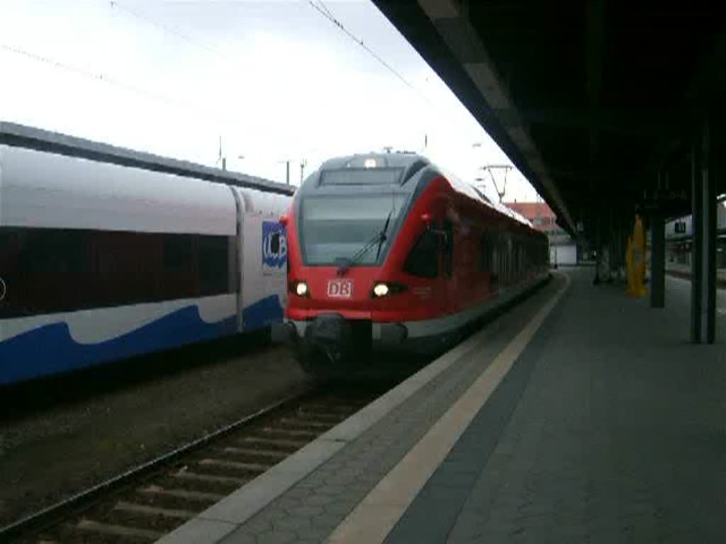 RE33313 von Stralsund Richtung Ostseebad Binz bei der Ausfahrt 
um 15.04 Uhr im Bahnhof Stralsund.(09.04.10)