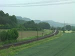 Eine Br 203 und eine V 200 mit einer Stopfmaschine am 02.06.2012 unterwegs bei Harrbach.