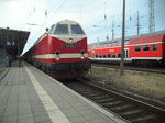 119 158-4 mit SDZ 88582 von Warnemnde Richtung Berlin-Schneweide kurz vor der Ausfahrt im Bahnhof Warnemnde.(07.08.10)