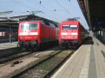 IC1805/1815 von Ostseebad Binz/Ostseebad Heringsdorf nach Kln Hbf.kurz vor der Abfahrt im Rostocker Hbf.links steht RE1 nach Hamburg Hbf.(04.04.09)