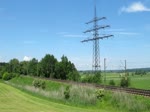 103 184-8 mit ihrem IC nach Rosenheim, gesehen an der Kurve hinter Grokarolinenfeld.