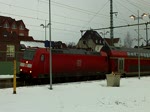 Ausfahrt RE, mit einer 146 und Durchfahrt der 140 024,an 10.02.2010 in Lehrte.