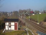 MEG 604 (91 80 6143 257-4 D-MEG]) und 247 042 zogen am 19.03.15 einen Zementzug durch Jößnitz.