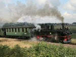 99 516 der Museumbahn Schnheide ist am 12. September 2009 mit einen Personenzug unterwegs.