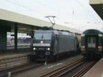 Ausfahrt der 185 573-3 von MRCE (vermietet an HGK AG) mit ihrem Kesselwagenzug aus Basel Bad Bf, in Richtung Freiburg(Brsg).