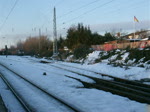 OHE-LOK 330090 verlsst mit den Holzzug Richtung Stendal-Niedergrne den Bahnhof Rostock-Bramow(21.02.10)