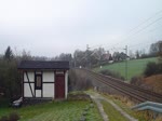 253 015-8 der Press zu sehen am 09.12.14 in Jößnitz/V.mit einem Leerholzzug. 