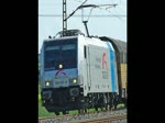185 697-0 mit Autotransportwagen in Fahrtrichtung Bebra bei Mecklar. Aufgenommen am 06.06.2010.