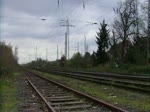 Die damals noch bei der HGK,zum Test fahrende Euro 4000 0004 005 am 1.4.11 mit dem Quardsandzug bei der Durchfahrt durch Ratingen-Lintorf.Gru an den TF! (Mit Makro)