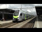 Das neuste Fahrzeug der BLS, der  MUTZ  (Multifunktionaler Triebzug) steht am 20.6.2013 in Thun zur Abfahrt bereit, als am Gleis 1 ein Güterzug einfährt.