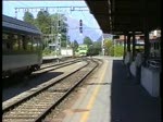 Berner Oberland 2004 (VHS-Archiv) - Am 29.05.2004 trifft in Interlaken Ost ein NINA als Regionalzug aus Spiez ein. Mit diesem Zug fahren wir nach Interlaken West. Dort beobachten wir die Einfahrt des  Golden Pass Panoramic  nach Zweisimmen, welcher an diesem Tag von der BLS Lok 251 gezogen wird.