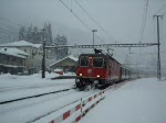 Ausfahrt eines IR nach Luzern am 10.12.2008 bei Faido bei starkem Schneefall...