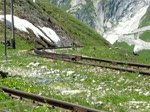 HG 3/4 1 der DFB krachselt den Berg hoch, kurz vor dem Furka-Scheiteltunnel am 28.06.2010