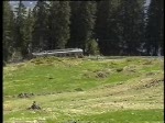 Berner Oberland 2004 (VHS-Archiv) - Nahe Grtschalp knnen wir am 24.05.2004 die Zge der BLM beobachten, im Hintergrund die Kulisse von Eiger, Mnch und Jungfrau.