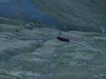 Kohlebefeuerte Lok 5 mit Personenwagen B1 als Sonderzug in der Abenddmerung beim Anstieg von der Oberstaffel zum Rothorn Kulm.